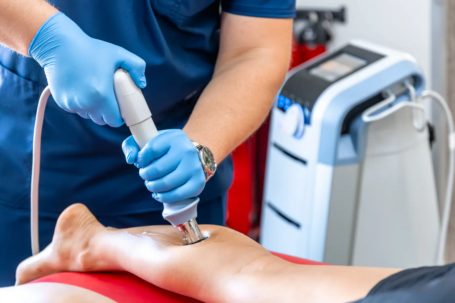 “Shockwave therapy main image at Gentle Giant Care LLC in Palm Springs, California — a clinician administering shockwave therapy with a handheld device to a client’s muscle or joint to promote healing and reduce pain.”